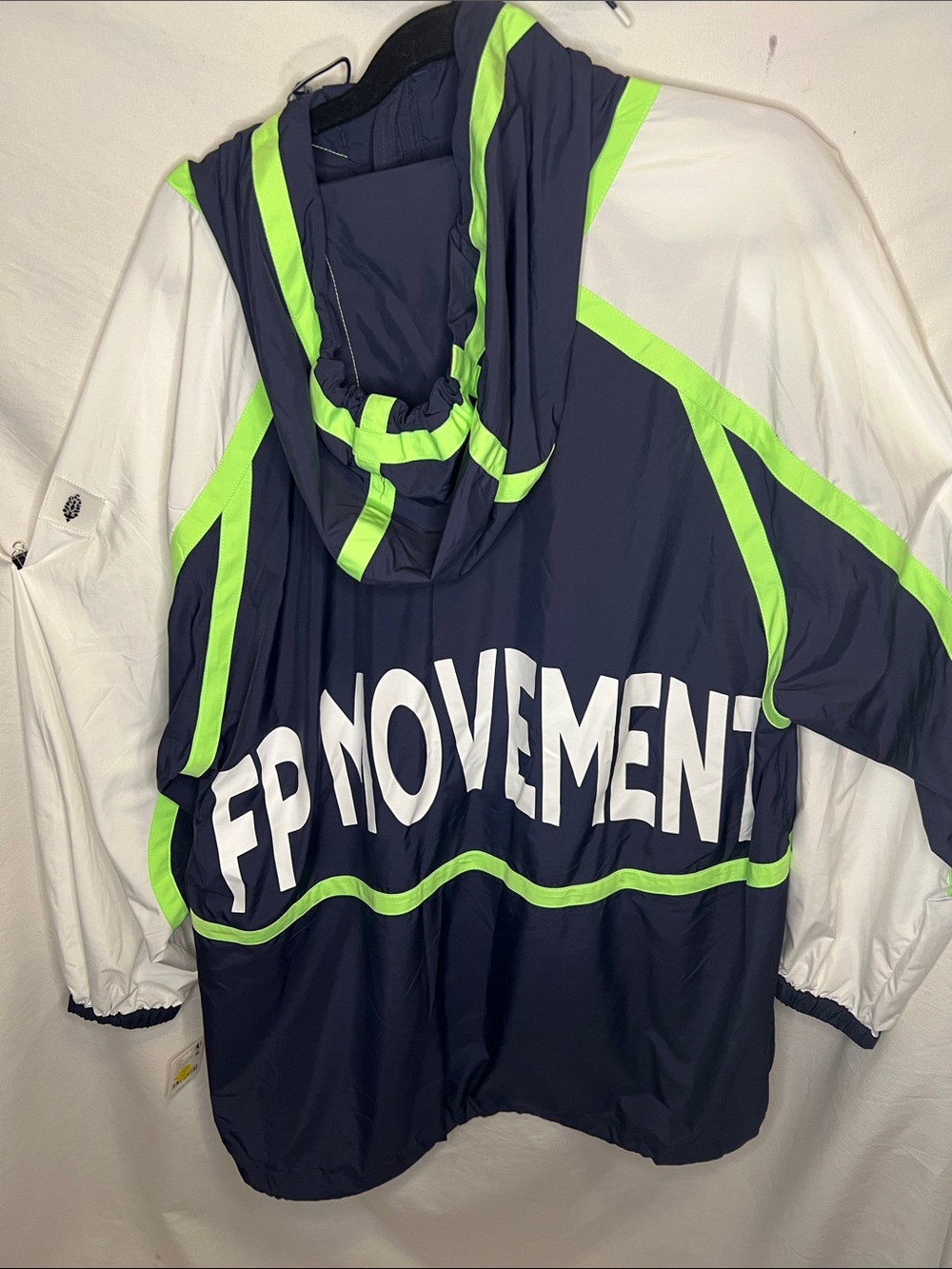FP Movement Cares By The Wind block Logo in Navy and Lime Green Jacket. - Picture 2 of 13